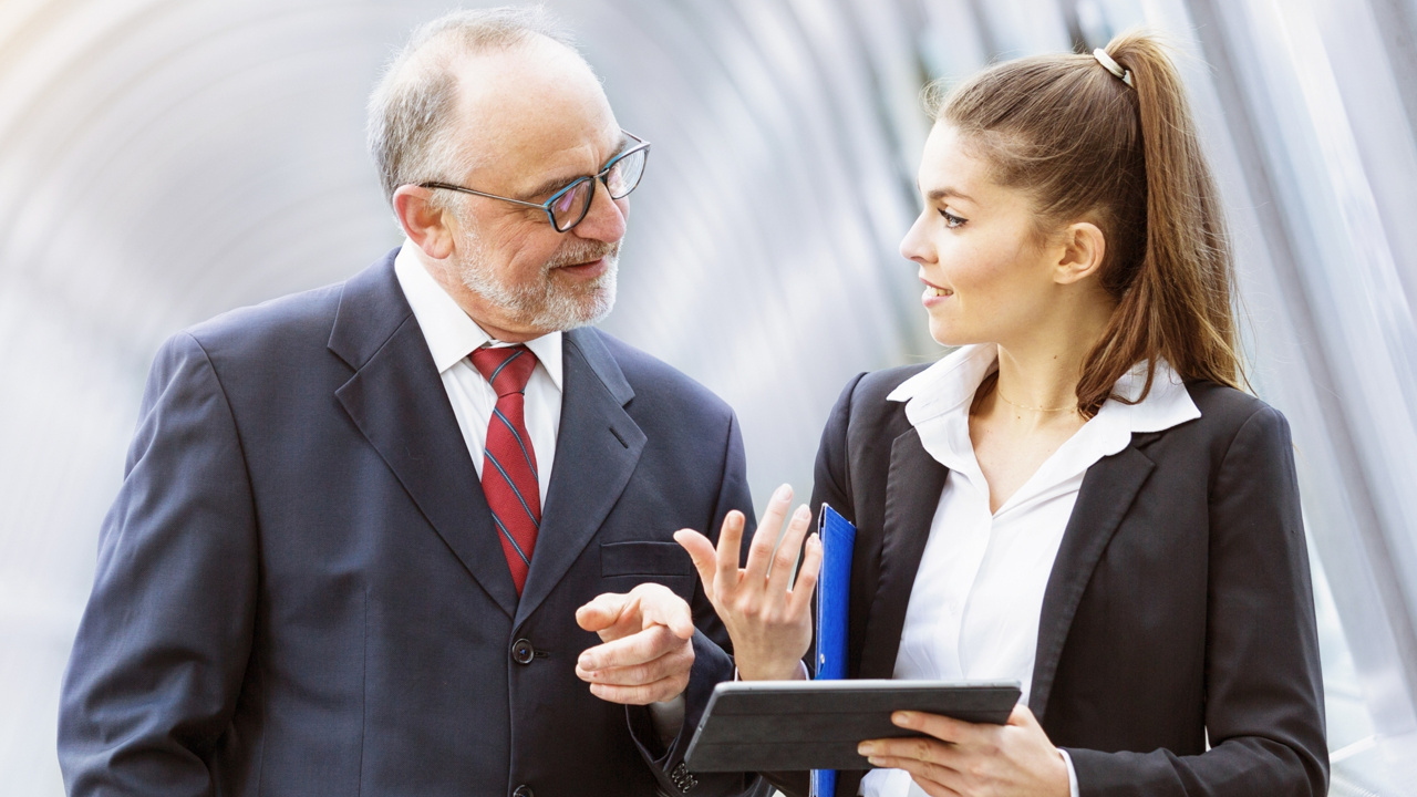 Two business individuals chatting