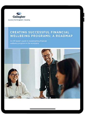 A tablet screen displaying a report on financial wellbeing programs.